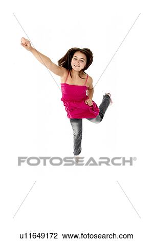 Stock Image - Young Girl Leaping In Studio. Fotosearch