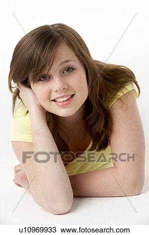 Young Girl Lying On Stomach In Studio View Large Photo Image Stock Image - Young Girl Lying On Stomach In Studio. Fotosearch
