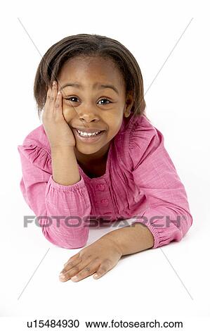 Young Girl Lying On Stomach In Studio View Large Photo Image Stock Image - Young Girl Lying On Stomach In Studio. Fotosearch