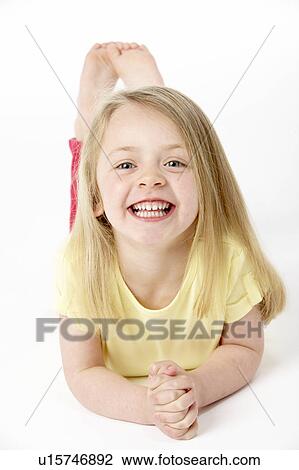 Young Girl Lying On Stomach In Studio View Large Photo Image Stock Image - Young Girl Lying On Stomach In Studio. Fotosearch