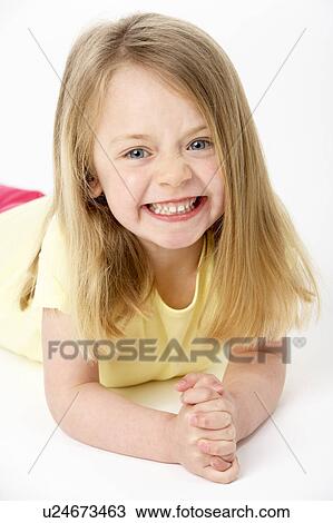 Young Girl Lying On Stomach In Studio View Large Photo Image Stock Image - Young Girl Lying On Stomach In Studio. Fotosearch