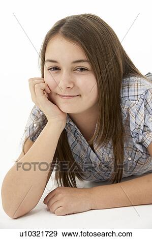 Young Girl Lying On Stomach In Studio View Large Photo Image Stock Photo - Young Girl Lying On Stomach In Studio. Fotosearch