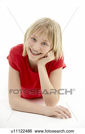 Young Girl Lying On Stomach In Studio View Large Photo Image Stock Photograph - Young Girl Lying On Stomach In Studio. Fotosearch