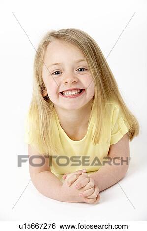 Young Girl Lying On Stomach In Studio View Large Photo Image Stock Photograph - Young Girl Lying On Stomach In Studio. Fotosearch