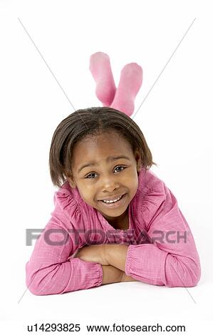 Young Girl Lying On Stomach In Studio View Large Photo Image Stock Photography - Young Girl Lying On Stomach In Studio. Fotosearch