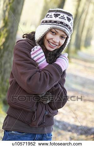 Stock Image - Young Girl On Autumn Walk. Fotosearch