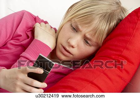 Young Girl Reading Text And Looking Worried View Large Photo Image Stock Photo - Young Girl Reading Text And Looking Worried. Fotosearch