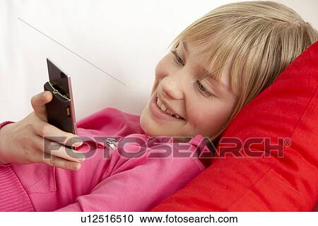 Young Girl Reading Text Message View Large Photo Image Stock Image - Young Girl Reading Text Message. Fotosearch