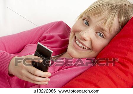 Young Girl Reading Text Message View Large Photo Image Stock Photograph - Young Girl Reading Text Message. Fotosearch