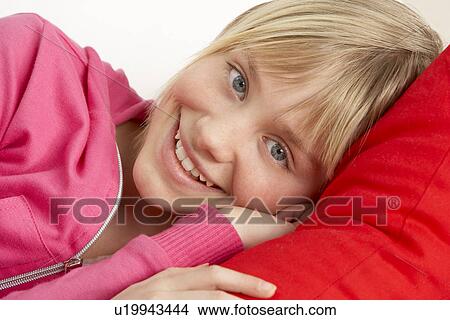 Young Girl Relaxing On Sofa View Large Photo Image Picture - Young Girl Relaxing On Sofa. Fotosearch