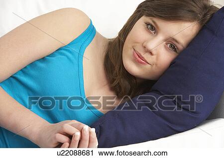 Young Girl Relaxing On Sofa View Large Photo Image Stock Image - Young Girl Relaxing On Sofa. Fotosearch
