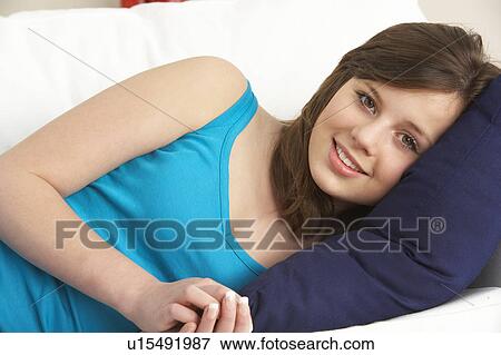 Young Girl Relaxing On Sofa View Large Photo Image Stock Photo - Young Girl Relaxing On Sofa. Fotosearch