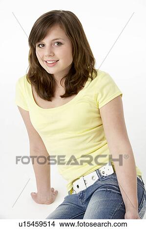 Picture - Young Girl Sitting In Studio. Fotosearch
