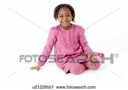 Stock Photo - Young Girl Sitting In Studio. Fotosearch