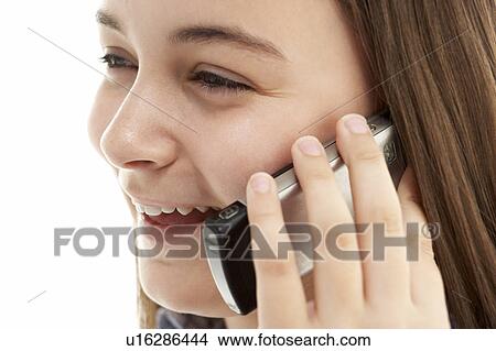 Picture - Young Girl Talking On Mobile Phone. Fotosearch