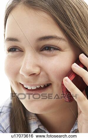 Stock Photograph - Young Girl Talking On Mobile Phone. Fotosearch