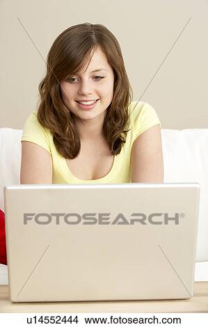 Young Girl Using Laptop At Home View Large Photo Image Picture - Young Girl Using Laptop At Home. Fotosearch