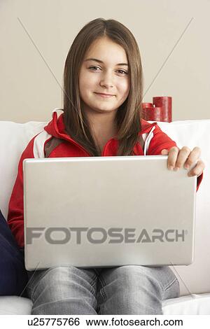 Young Girl Using Laptop At Home View Large Photo Image Stock Photograph - Young Girl Using Laptop At Home. Fotosearch