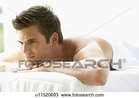 Young Man Relaxing On Massage Table View Large Photo Image Stock Image - Young Man Relaxing On Massage Table. Fotosearch