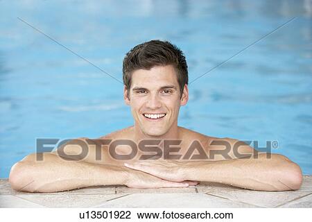 Young Man Resting On Edge Of Swimming Pool View Large Photo Image Stock Image - Young Man Resting On Edge Of Swimming Pool. Fotosearch