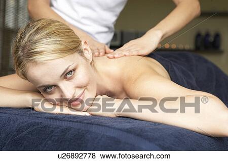 Young Woman Enjoying Hot Stone Treatment View Large Photo Image Stock Photo - Young Woman Enjoying Hot Stone Treatment. Fotosearch