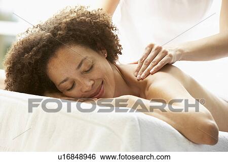 Young Woman Enjoying Hot Stone Treatment View Large Photo Image Stock Photograph - Young Woman Enjoying Hot Stone Treatment. Fotosearch