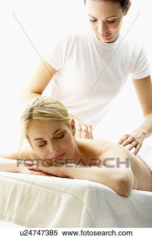 Stock Photography - Young Woman Enjoying Massage. Fotosearch