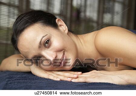 Picture - Young Woman Relaxing On Massage Table. Fotosearch