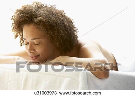 Young Woman Relaxing On Massage Table View Large Photo Image Stock Image - Young Woman Relaxing On Massage Table. Fotosearch