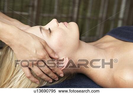 Stock Photography - Young Woman Relaxing On Massage Table. Fotosearch