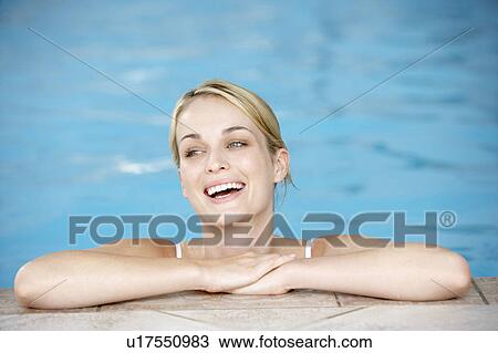 Young Woman Resting On Edge Of Swimming Pool View Large Photo Image Stock Image - Young Woman Resting On Edge Of Swimming Pool. Fotosearch