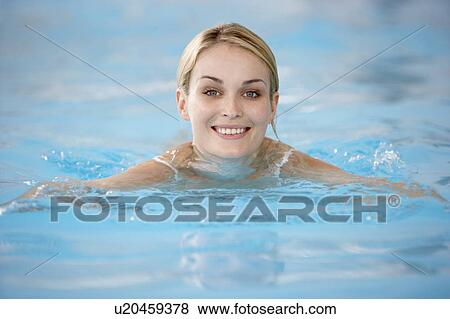 Young Woman Swimming In Pool View Large Photo Image Stock Photo - Young Woman Swimming In Pool. Fotosearch