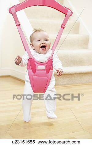 Stock Photography - Baby In Bouncer. Fotosearch