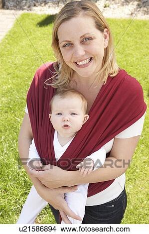 Baby In Sling With Mother Outdoors View Large Photo Image Picture - Baby In Sling With Mother Outdoors. Fotosearch