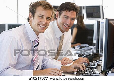 Colleagues Working Together At Computer View Large Photo Image Stock Photo - Colleagues Working Together At Computer. Fotosearch