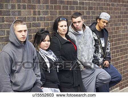 Stock Image - Gang Of Youths Leaning On Wall. Fotosearch