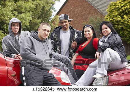 Gang Of Youths Sitting On Cars View Large Photo Image Stock Photography - Gang Of Youths Sitting On Cars. Fotosearch