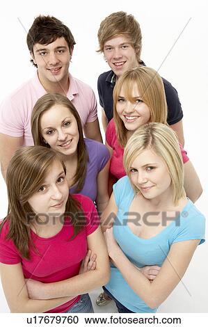 Stock Image - Group Of Teenage Friends In Studio. Fotosearch
