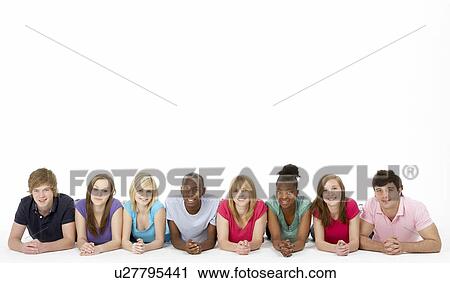 Stock Image - Group Of Teenage Friends In Studio. Fotosearch