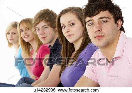 Stock Photograph - Group Of Teenage Friends In Studio. Fotosearch