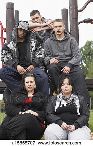 Stock Photo - Group Of Young People In Playground. Fotosearch