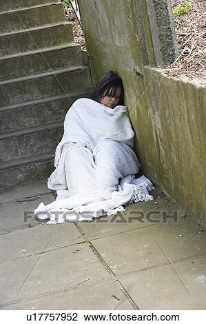 Stock Image - Homeless Girl Sleeping Rough. Fotosearch