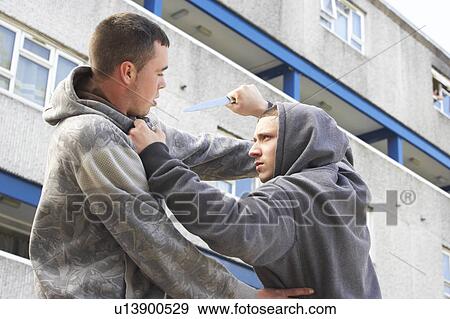 Stock Photo - Knife Crime On Urban Street. Fotosearch