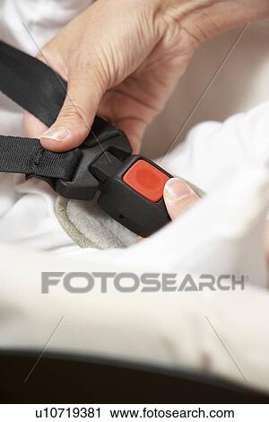 Mother Fastening Safety Clip On Baby Seat View Large Photo Image Stock Image - Mother Fastening Safety Clip On Baby Seat. Fotosearch