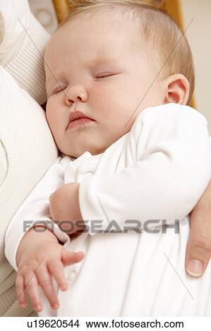 Mother Holding Sleeping Baby In Nursery View Large Photo Image Picture - Mother Holding Sleeping Baby In Nursery. Fotosearch
