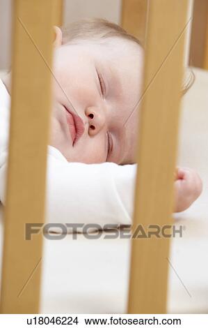 Picture - Newborn Baby In Cot. Fotosearch