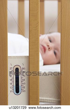 Newborn Baby In Cot With Thermometer View Large Photo Image Stock Photo - Newborn Baby In Cot With Thermometer. Fotosearch