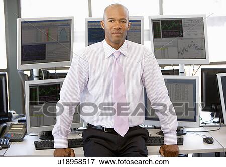 Stock Photo - Portrait Of Stock Trader In Front Of Computer Monitors. Fotosearch