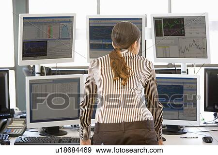 Stock Trader Examining Computer Monitors View Large Photo Image Stock Photo - Stock Trader Examining Computer Monitors. Fotosearch