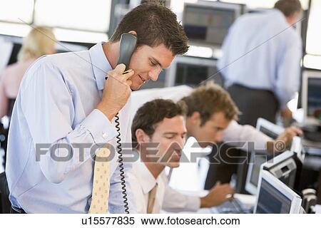 Stock Photography - Stock Trader On The Phone. Fotosearch